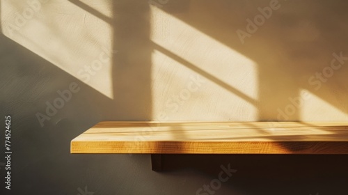 A sleek, polished wooden tabletop bathed in warm sunlight, casting subtle shadows against a neutral backdrop.