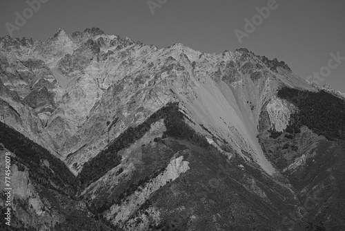 Rocky mountain with different minerals and a triangular shape in Argentine Patagonia, black and white photo.