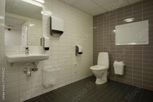 White Toilet Bowl In A Bathroom