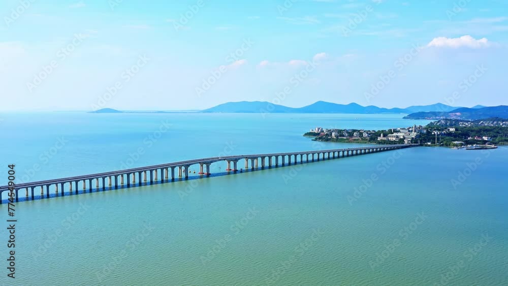 Aerial video of highway road and lake with mountains natural landscape in Taihu, Suzhou. Aerial video of highway road and lake with mountains natural landscape in Taihu, Suzhou.