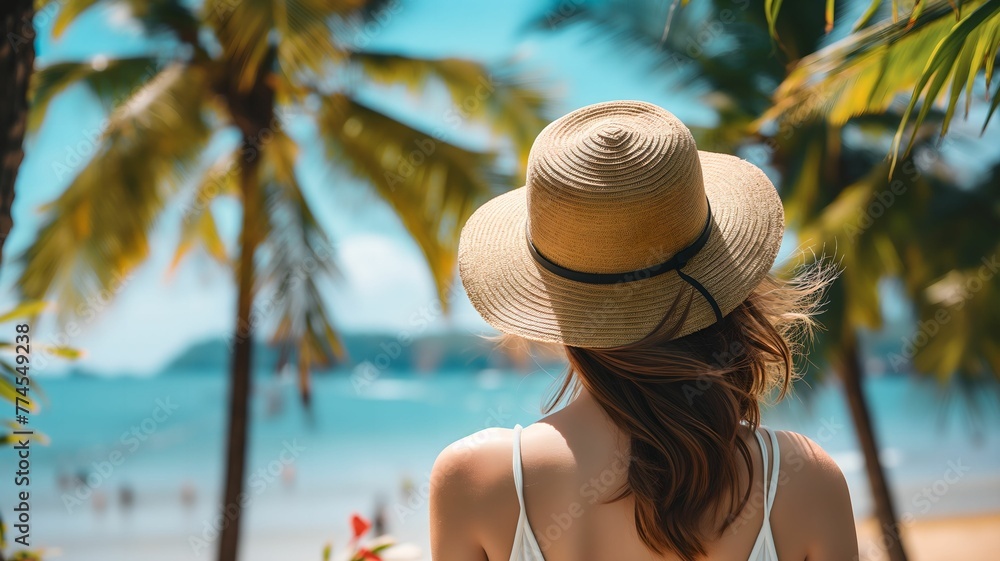 Happy woman with hat at seaside, summer vacation concept