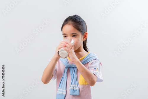 Little Asian girl Image of Asian child drinking milk