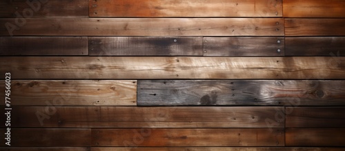 A detailed close up view of a wooden wall featuring a shiny metal plate attached to it