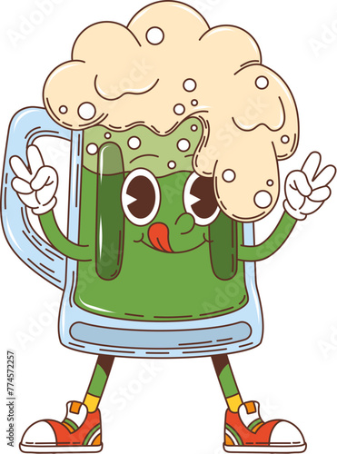 Cartoon green groovy ale beer character, saint Patrick day holiday mug personage. Isolated vector funky glass cup filled with traditional foamy Irish drink, showing peace gesture and sticking tongue