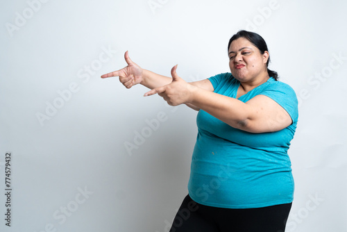 Overweight fat indian woman pointing finger. isolated over white background. Plus size female. Healthcare Concept. Copy Space