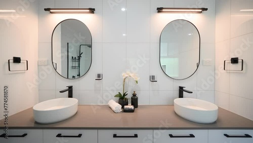 Minimalistic Luxury Double Dual Vanity Bathroom with Modern Appliances and Individual Counter Spaces. Interior of house home for real estate property. photo