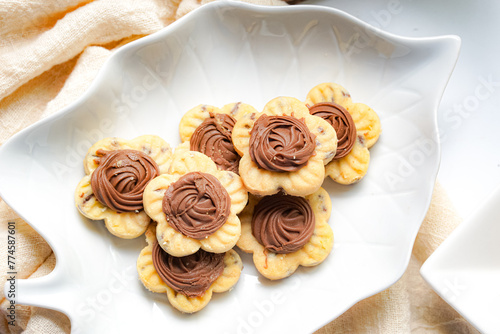 Popular cookies in Malaysia and Singapore during celebration of Eid Mubarak (Hari Raya) on white background. Selective focus and blurry. photo