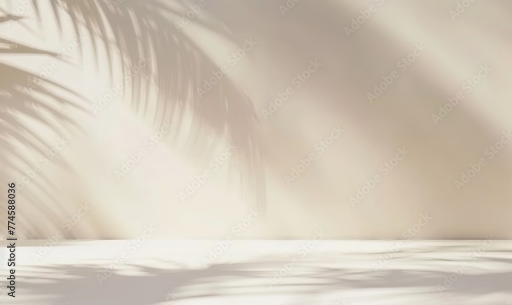Obraz premium Blurred shadow cast by palm leaves on a light cream wall provides a minimalist yet captivating backdrop, ideal for product presentations during the summer and spring. Made with generative AI technolog