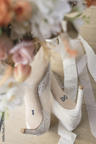 Elegant bridal heels adorned with “I DO” inscription, capturing wedding romance photo