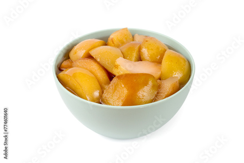 Sliced canned apples in a bowl on a white background. Natural homemade fruits.