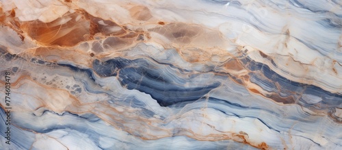 A detailed view of a smooth marble surface showcasing bright shades of blue and orange