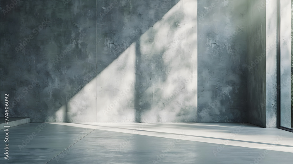 A large room with a window and a wall. The wall is made of concrete and the room is empty A large room with a window and a wall. The wall is made of concrete and the room is empty