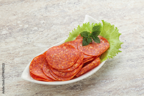 Sliced pepperoni sausage in the bowl