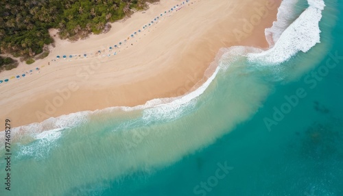Turquoise water with wave with sand beach background aerial top view in sunset. Concept summer