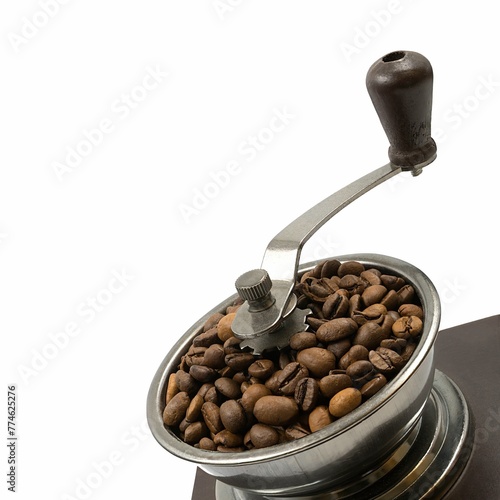 Old coffee grinder with coffee beans on white background