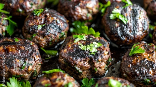  Close-up of meatballs with parsley on top and garnished with parsley