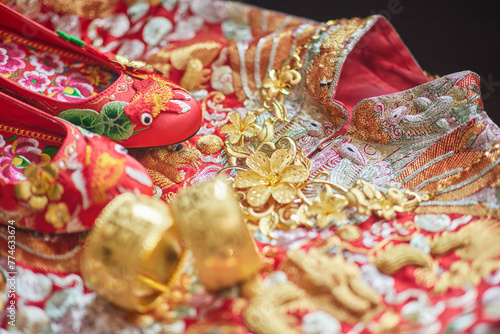 Golden jewelry on embroidered traditional Chinese wedding textile