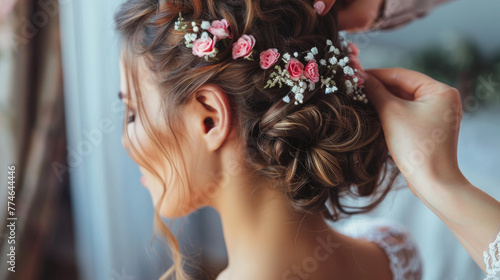 The hairdresser does the bride's hair.
