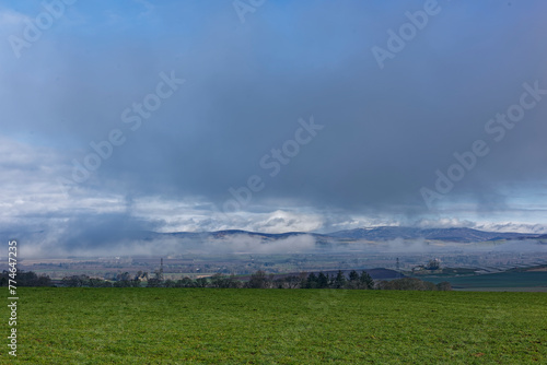 The early morning low cloud clearing from the floor of the Strathmore Valley, with the Hills of the Angus Lens in the background. photo