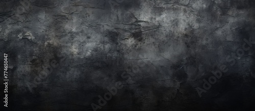 Close-up view of a dark black wall with a contrasting white and black background, highlighting textures and patterns