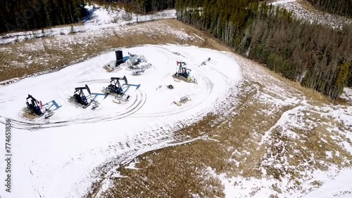 Pumpjacks in Pine: Aerial View of Oil Extraction in Forest