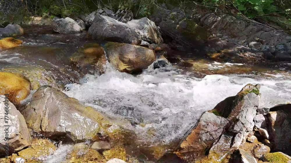 Beautiful waterfall in mountains in summer ,fast sreams Beautiful waterfall in mountains in summer ,fast sreams