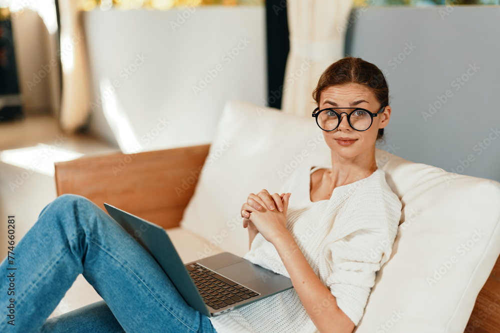 Happy Woman Working on Laptop in Modern Home Office, Enjoying Online Freelancer Lifestyle