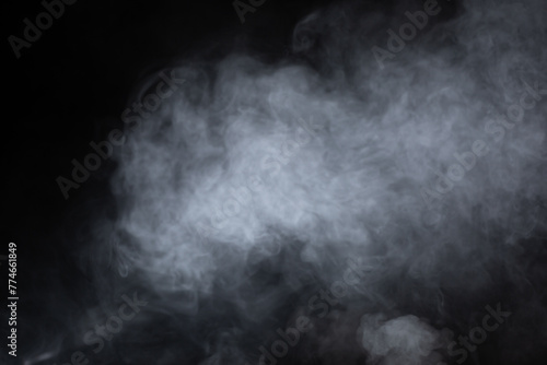 Mysterious smoke on dark background