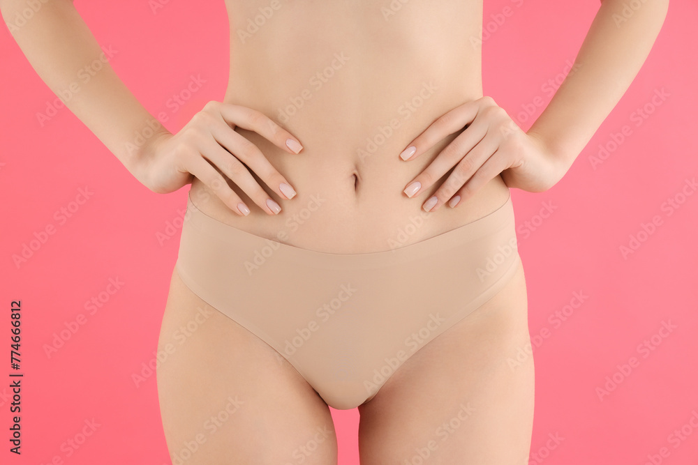 Slim girl in pink underwear, on a pink background. - obrazy, fototapety, plakaty 