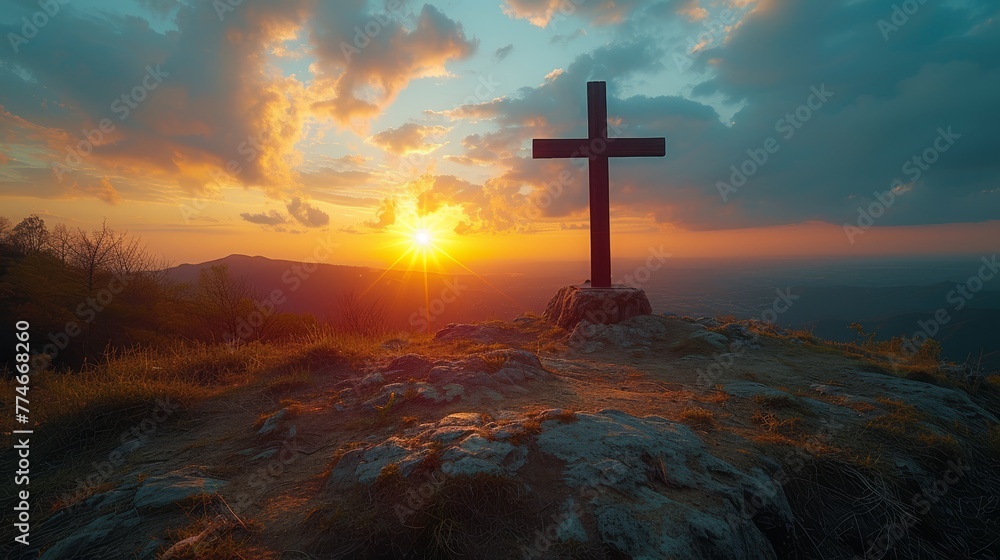   A hilltop cross against a sunset backdrop, with clouds scattering above - obrazy, fototapety, plakaty 