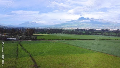 Aerial view of El Corazón Volcano from cultivated valley. western mountain range of the Andes