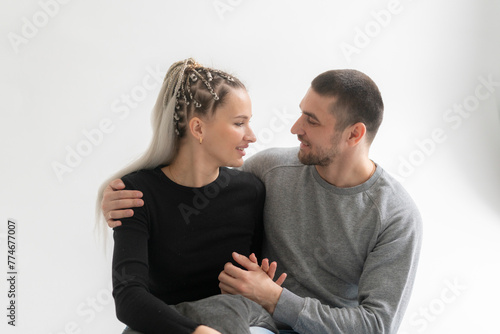 Romantic Couple in casual clothes Sharing an Intimate tender Embrace Inside a Cozy Room