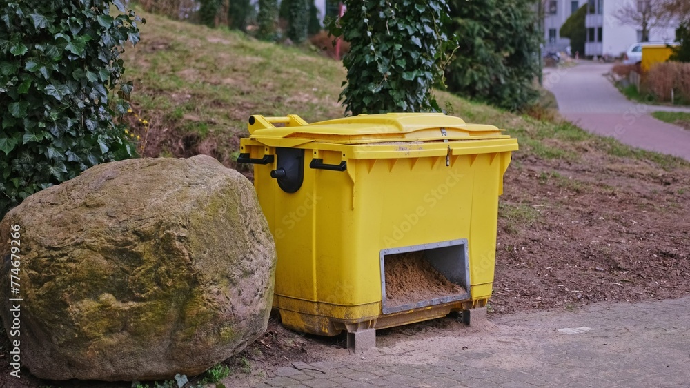 Yellow Plastic Grit Sand Box Prepared for Winter Pavement Icing Yellow Plastic Grit Sand Box Prepared for Winter Pavement Icing