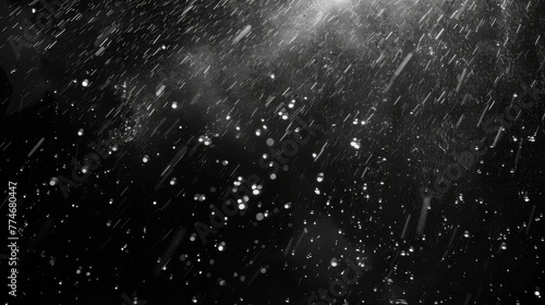 Rain on a black background. Raindrops falling against a backdrop of darkness, creating a serene ambiance. photo