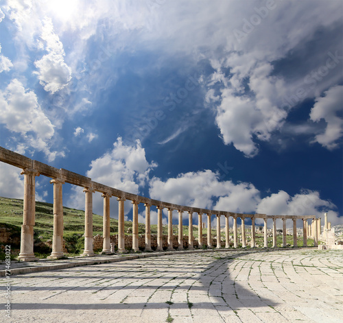 Forum (Oval Plaza) in Gerasa (Jerash), Jordan. Was built in the first century AD. Against the background of a beautiful sky with clouds. #774683022