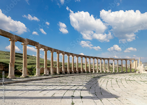 Forum (Oval Plaza) in Gerasa (Jerash), Jordan. Was built in the first century AD. Against the background of a beautiful sky with clouds. #774683036