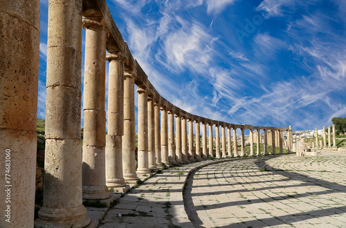 Forum (Oval Plaza) in Gerasa (Jerash), Jordan. Was built in the first century AD. Against the background of a beautiful sky with clouds. photo