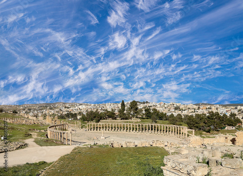 Forum (Oval Plaza) in Gerasa (Jerash), Jordan. Was built in the first century AD. Against the background of a beautiful sky with clouds. #774683207