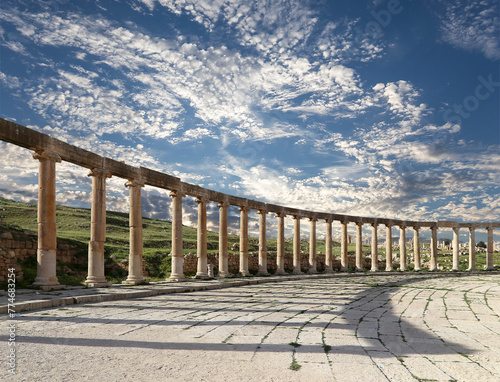Forum (Oval Plaza) in Gerasa (Jerash), Jordan. Was built in the first century AD. Against the background of a beautiful sky with clouds. #774683254
