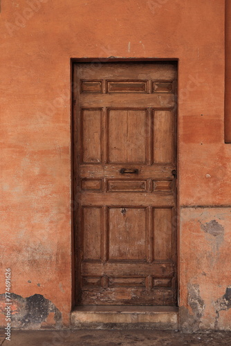 Wooden Door at the San Lorenzo in Lucina Church Portico in Rome, Italy