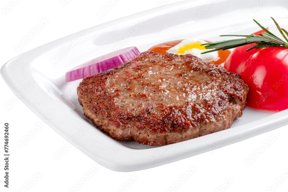 Grilled burger patty and burger ingredients on a white plate on a white background, close up Grilled burger patty and burger ingredients on a white plate on a white background, close up