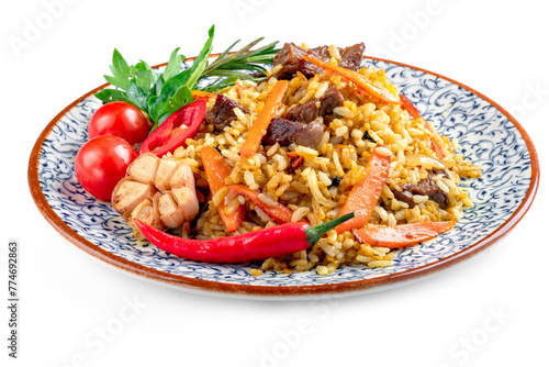 Pilaf with mutton, a dish of stewed meat with rice, carrots, onions and garlic. Oriental cuisine with spices and rice, isolated on white