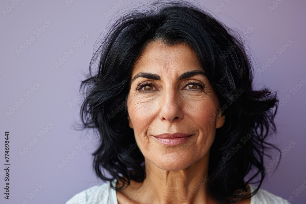 Portrait of a beautiful middle aged woman with long black hair. Portrait of a beautiful middle aged woman with long black hair.