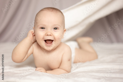 happy baby after bath, 8 month old baby laughs © Leka