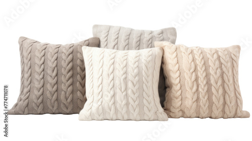 A quartet of fluffy pillows in assorted colors on a plain white background
