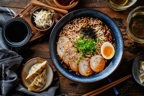 Traditional Japanese ramen bowl with condiments and soy sauce, authentic cuisine, dining concept

