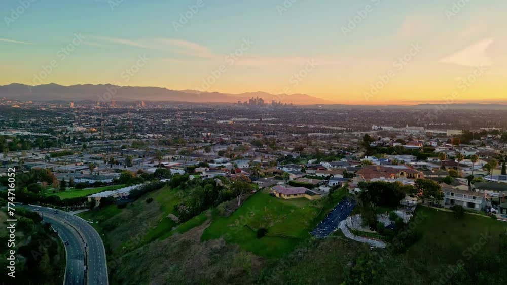 Aerial drone viewpoint cityscape of Los Angeles LA Kenneth Hanh sightseeing city town with mountain background and colorful golden hour skyline Aerial drone viewpoint cityscape of Los Angeles LA Kenneth Hanh sightseeing city town with mountain background and colorful golden hour skyline