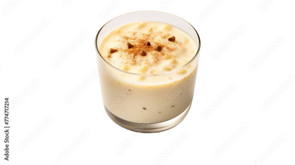 A glass filled with milk and sprinkled with aromatic cinnamon on top A glass filled with milk and sprinkled with aromatic cinnamon on top