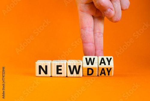 New day and way symbol. Concept word New day New way on beautiful wooden cubes. Beautiful orange table orange background. Businessman hand. Business new day and way concept. Copy space.