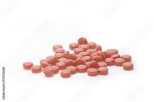 Close-up of reddish brown pill